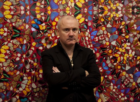 damien-hirst-and-one-of-his-entymology-paintings.jpg